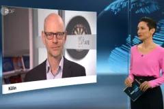 Screenshot from TV interview with moderator on the right and screen showing Niklas Höhne on the left