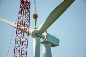 crane building a wind turbine